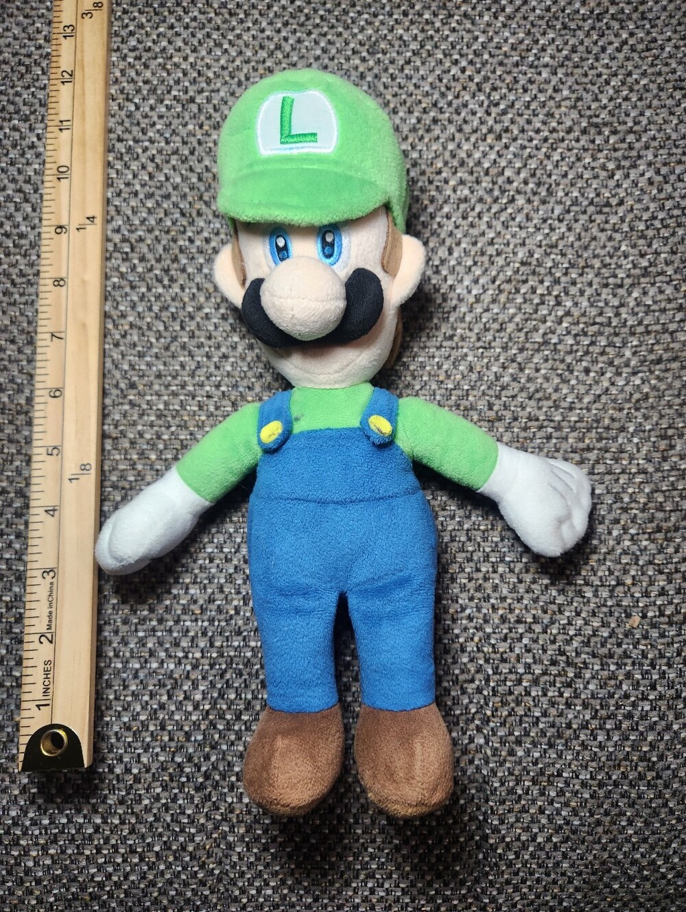 Luigi plush toy from the Super Mario Bros. series